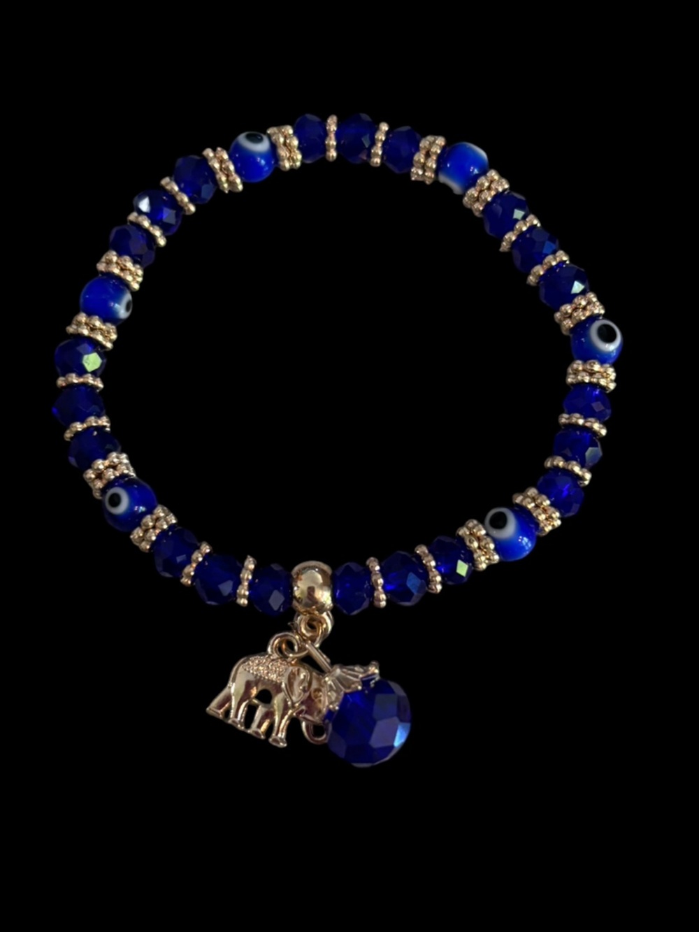 Blue Evil Eye Stretch Beaded Bracelet w/ Elephant Charm. Gold Tone hardware.